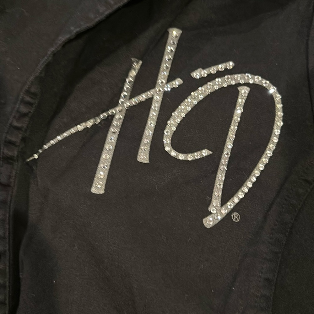 Harley-Davidson. Black with bling writing. Zip up. Fitted. Shirt. Short sleeves